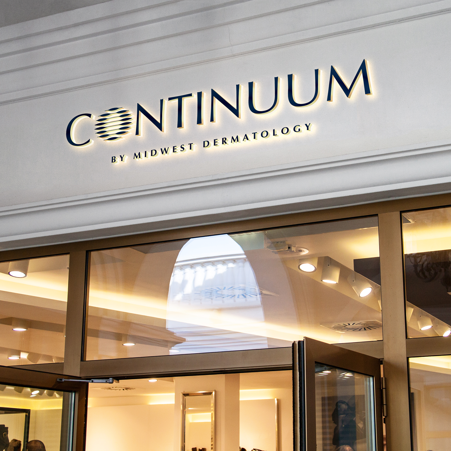Storefront with 'Continuum by Midwest Dermatology' sign